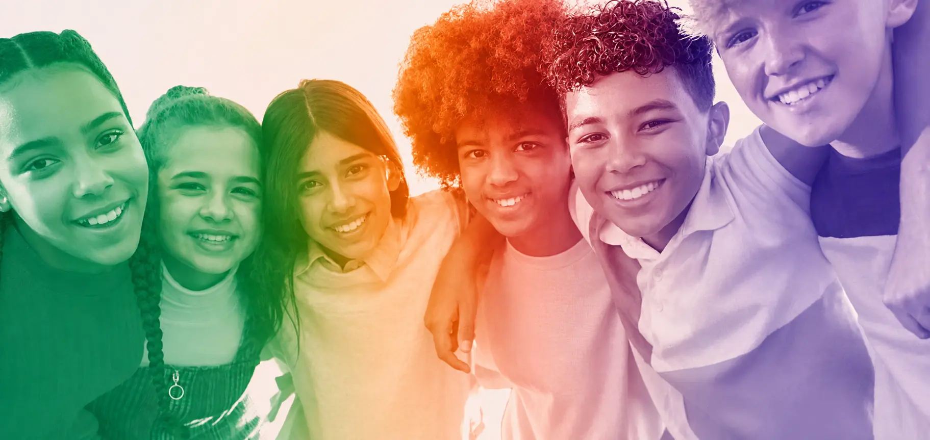 A group of smiling children, in Dyslexia Scotland's rainbow treatment